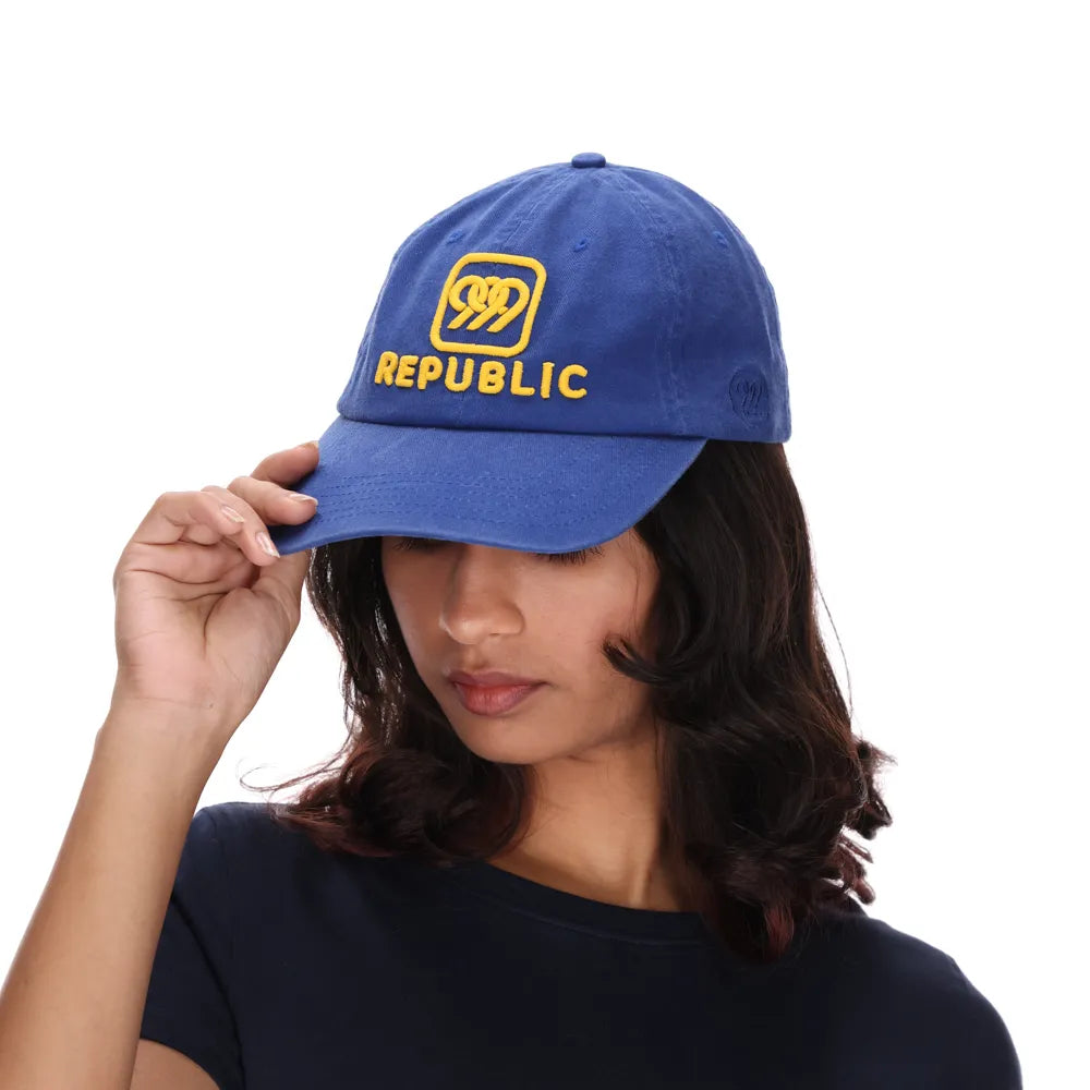 999Republic logo embroidered with gold matt finish thread on a Blue coloured Dad cap