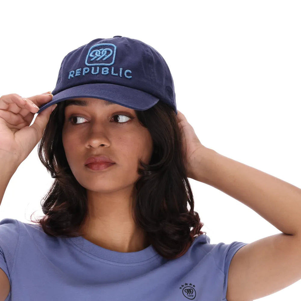 999Republic logo embroidered with Blue Metallic Thread on a Navy coloured Dad cap.